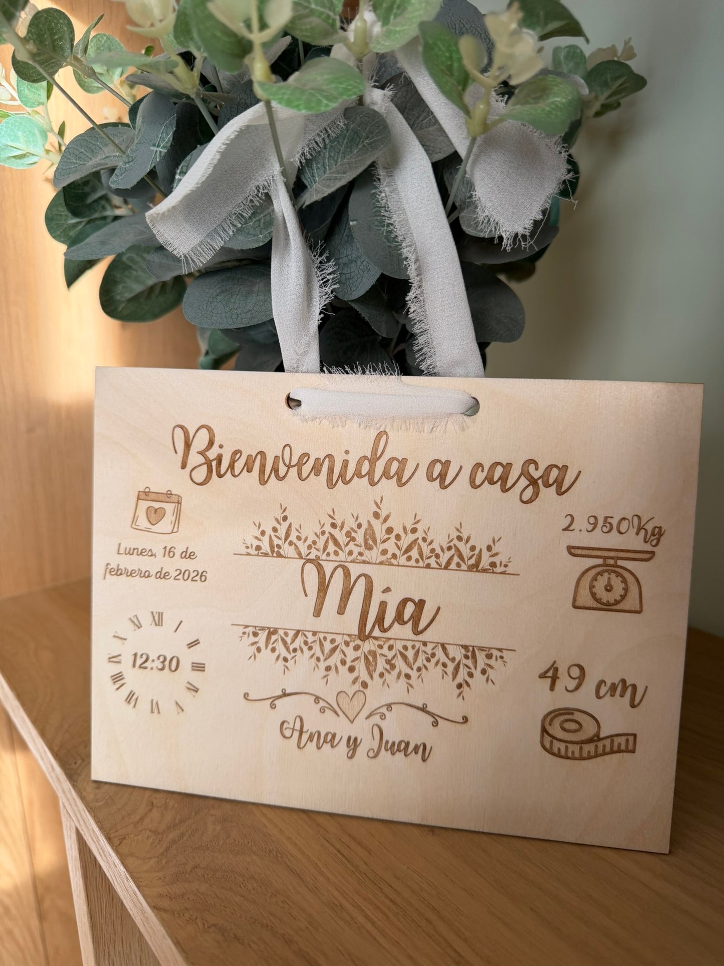 Los datos de su nacimiento en madera